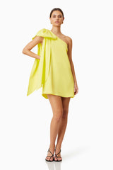 Model wearing Kennedy Party Mini Dress in Yellow Movement Shot