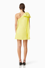 Model wearing Kennedy Party Mini Dress in Yellow Back Shot