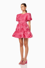 model wearing Wylla mini ruffled pink dress side shot
