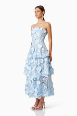 Brunette model wears Selene Maxi 3D floral Dress In Blue in heels side shot 