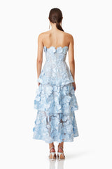 Brunette model wears Selene Maxi 3D floral Dress In Blue in heels back shot 