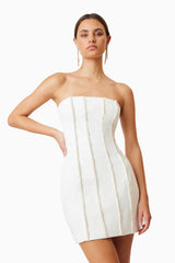 Sonnet Mini Strapless Pearl Dress In White with silver heels mood shot 