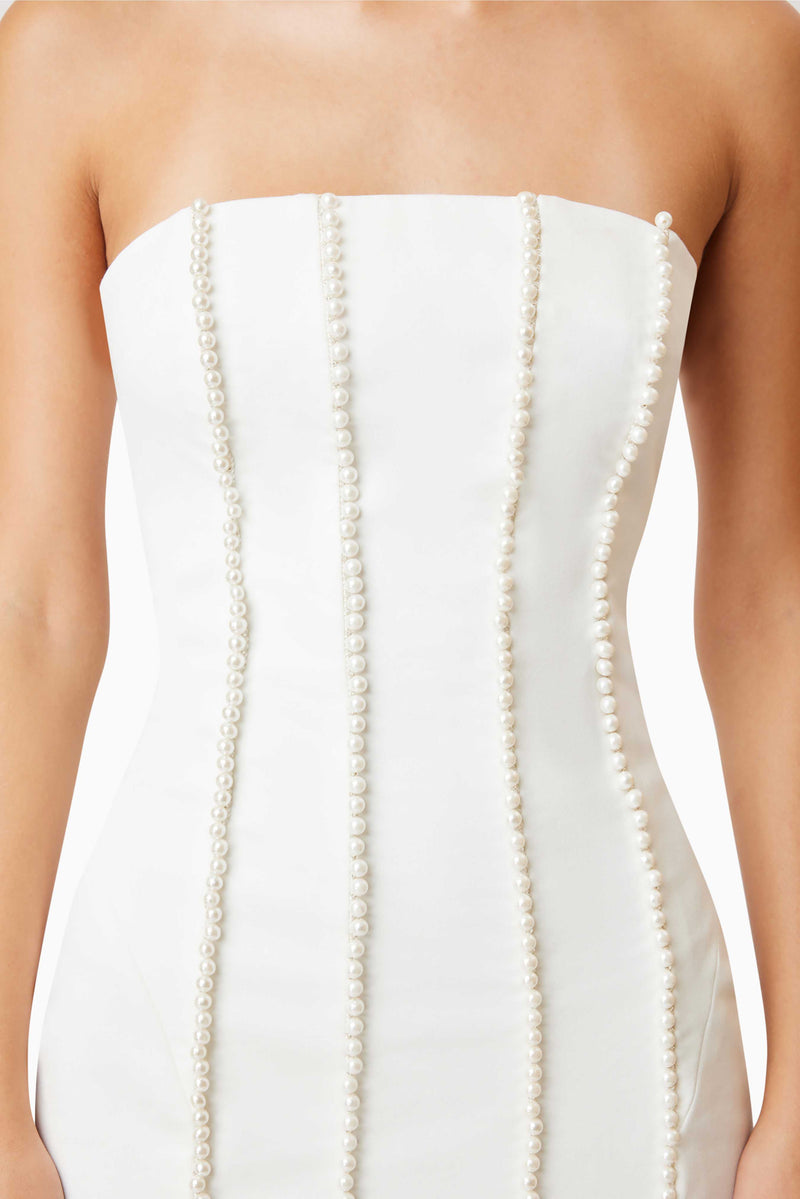 Sonnet Mini Strapless Pearl Dress In White with silver heels close up shot 