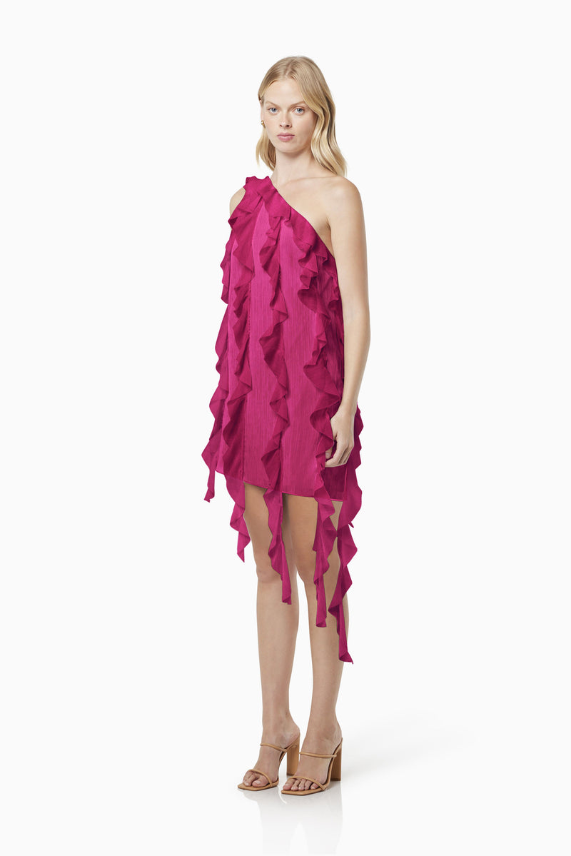 blonde model wearing Zoe textured sheer mini dress in pink side shot