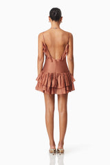 model wearing Fauna Party Mini Dress In Brown back shot