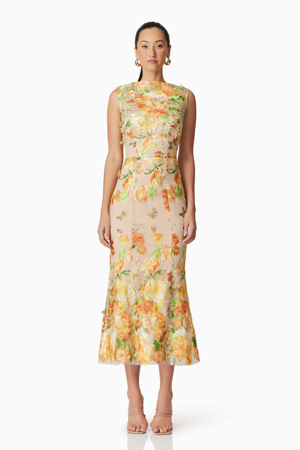 Brunette model wearing Aella Butterfly Midi Dress in Yellow front shot 