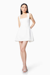 Brunette model wearing JULIET SQUARE NECKLINE MINI DRESS IN WHITE front shot