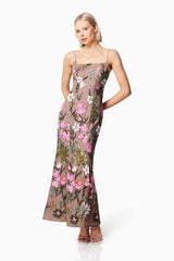 Blonde model wearing MESMERIZE FLORAL SEQUIN MAXI DRESS IN MULTI front shot