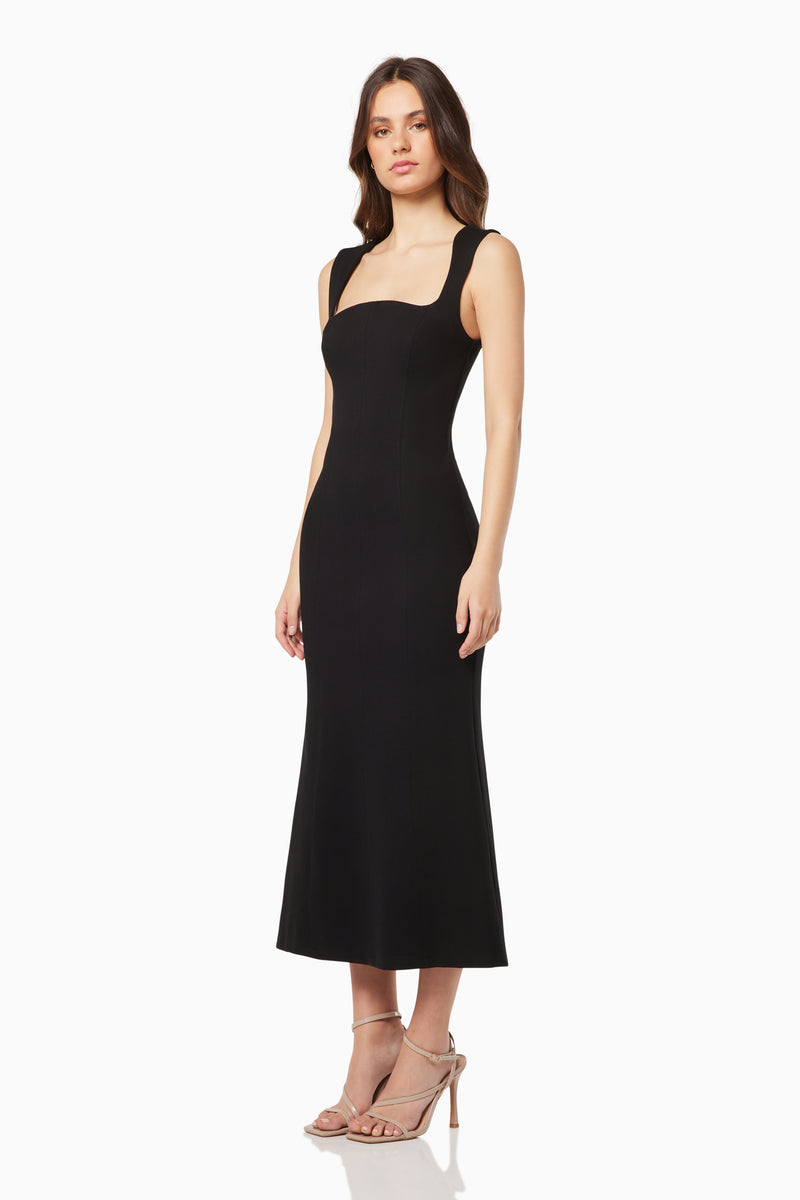 Brunette model wears the Perri Sculpted Square Neck Midi Dress in Black side shot