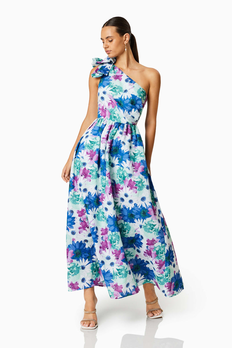 BROWN HAIR MODEL WEARING ALOHA ONE SHOULDER MIDI DRESS IN MULTI FRONT SHOT