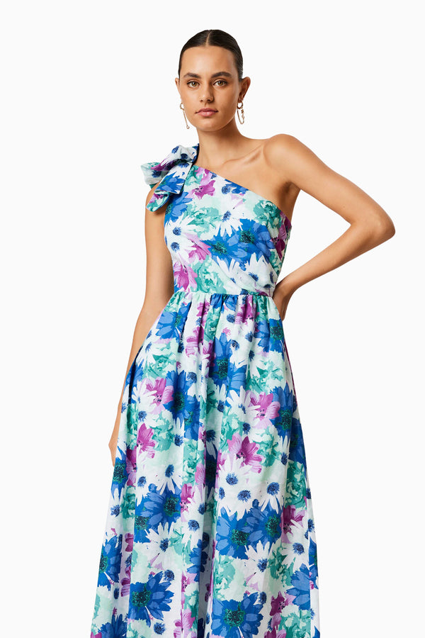 BROWN HAIR MODEL WEARING ALOHA ONE SHOULDER MIDI DRESS IN MULTI FRONT SHOT