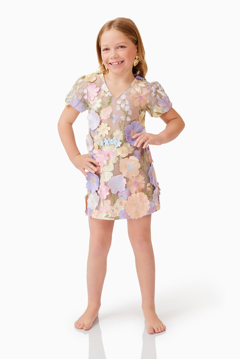 Blonde model wearing Anthea Embroidered Girls Dress in Purple hands on hips pose