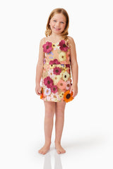 Blonde child model wearing Rosalind Girls Dress in Floral front smiling shot