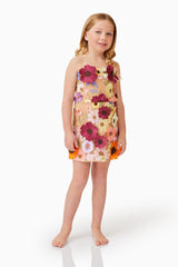 Blonde child model wearing Rosalind Girls Dress in Floral front happy shot