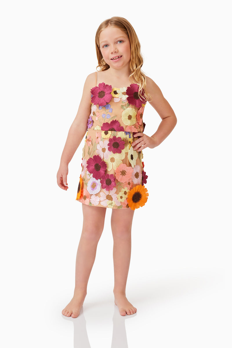 Blonde child model wearing Rosalind Girls Dress in Floral posed shot