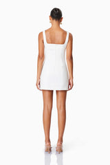 model wearing Bethany Mini Party Dress In White back shot