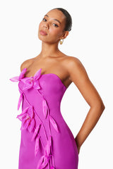 model wearing Bethany Strapless Floral Midi Dress In Purple side shot