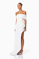 Model wearing Bethany Off The Shoulder Maxi Gown In White side shot