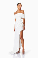 Model wearing Bethany Off The Shoulder Maxi Gown In White side shot