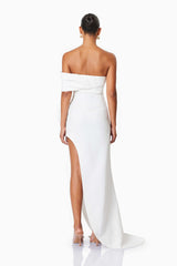 Model wearing Bethany Off The Shoulder Maxi Gown In White back shot