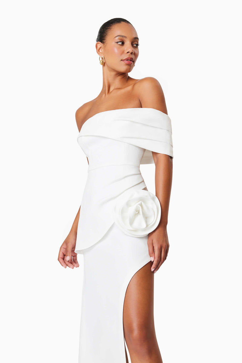 Model wearing Bethany Off The Shoulder Maxi Gown In White side shot