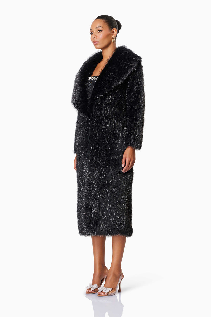 model wearing Cosette Faux Fur Coat In Black side shot