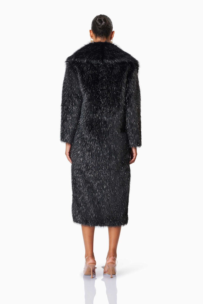 model wearing Cosette Faux Fur Coat In Black back shot