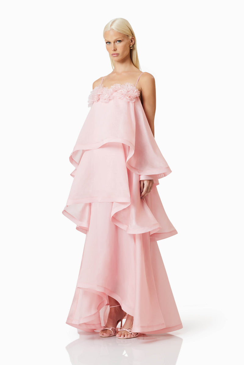 blonde model wearing Swallowtail Day To Night Maxi Dress In Pink side shot